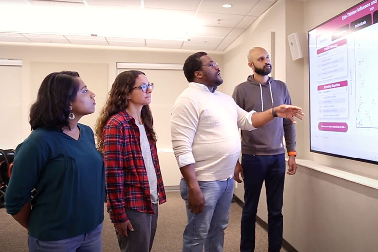 Researchers working on a project together