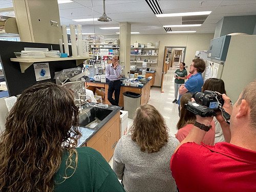 Teachers participating in the Medical Research Education Project tour Professor Harikrishna Nakshatri's research lab at the IU Melvin and Bren Simon Comprehensive Cancer Center.